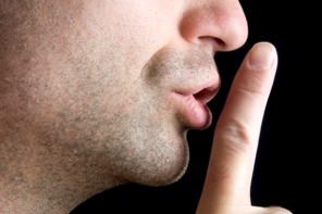 Person telling someone to be quiet